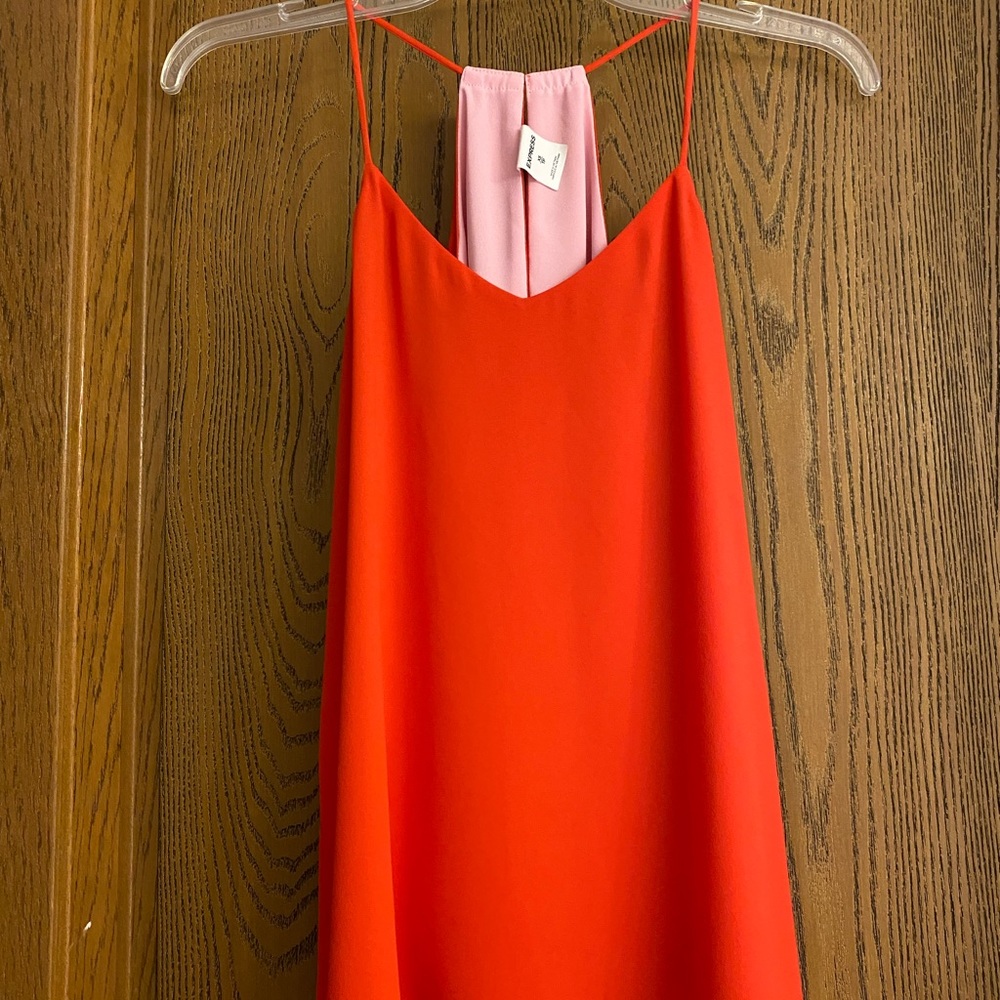 Small Reversible orange and and pink. Cute back with a space open. See pic